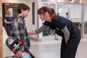 A scene from The Pitt in which Dr. Cassie McKay speaks to her son near the ER.