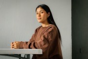 Nory Sontay Ramos in the dining room of the apartment in Quetzaltenango, Guatemala that she shares with an older sister.