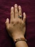 Nory Sontay Ramos wears a ring her mother gifted her and a bracelet with her mother's name that she had made after Estela Ramos Baten died in Quetzaltenango, Guatemala.
