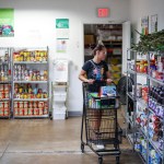 A customer shops at the Feeding South Florida food pantry.