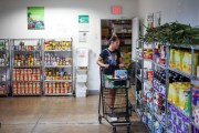 A customer shops at the Feeding South Florida food pantry.
