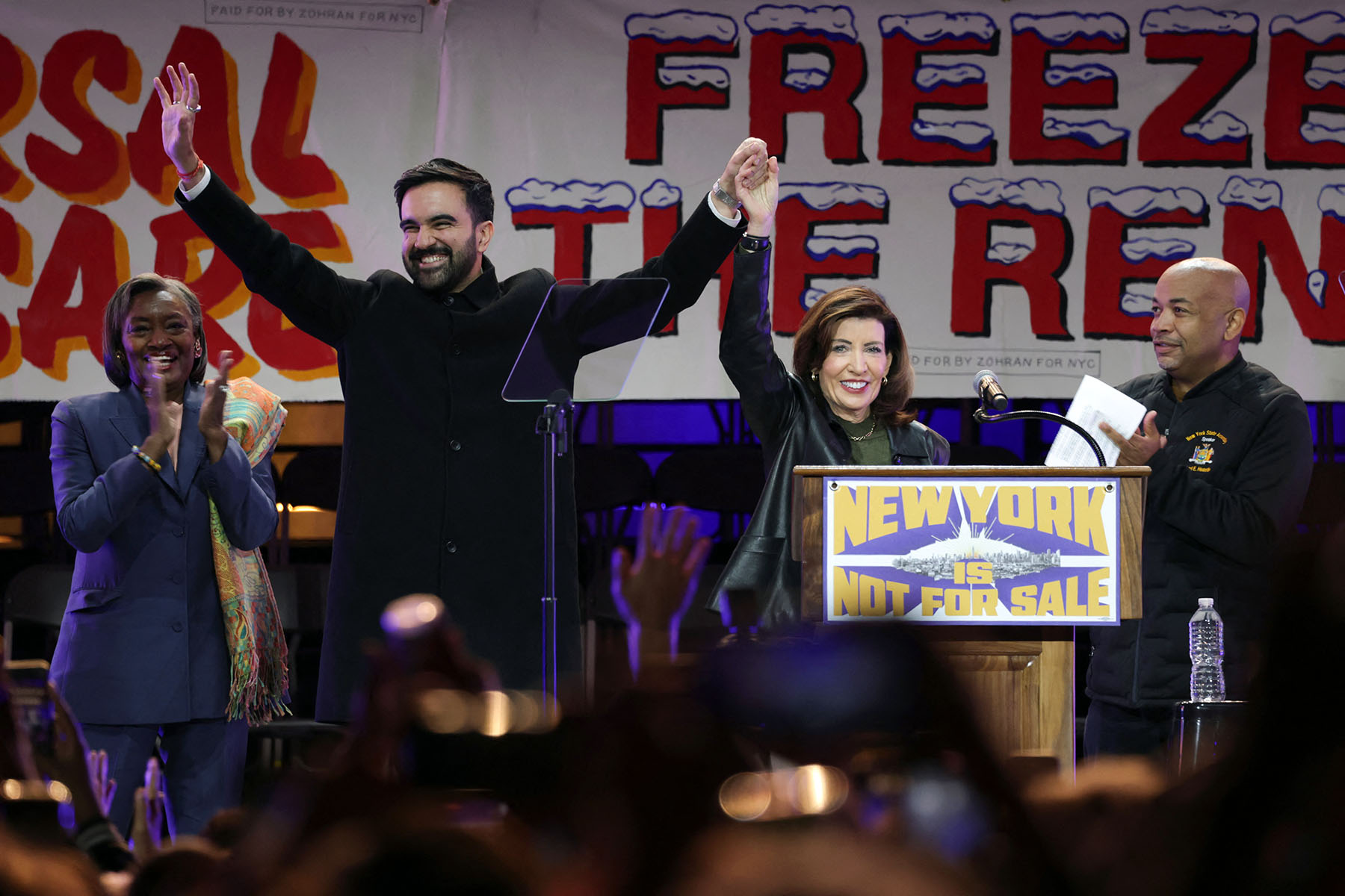 New York City mayoral candidate Zohran Mamdani holds hands with New York Governor Kathy Hochul on stage during a campaign rally at Forest Hills Stadium in the Queens borough of New York City.