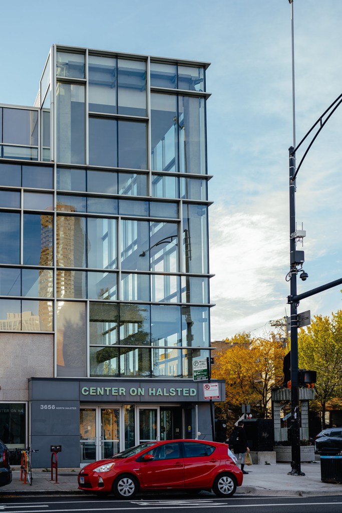 Glass-fronted building with a sign reading “Center on Halsted” at street level.