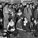 Eleanor Roosevelt is pictured with female journalists in the Treaty Room of the White House.
