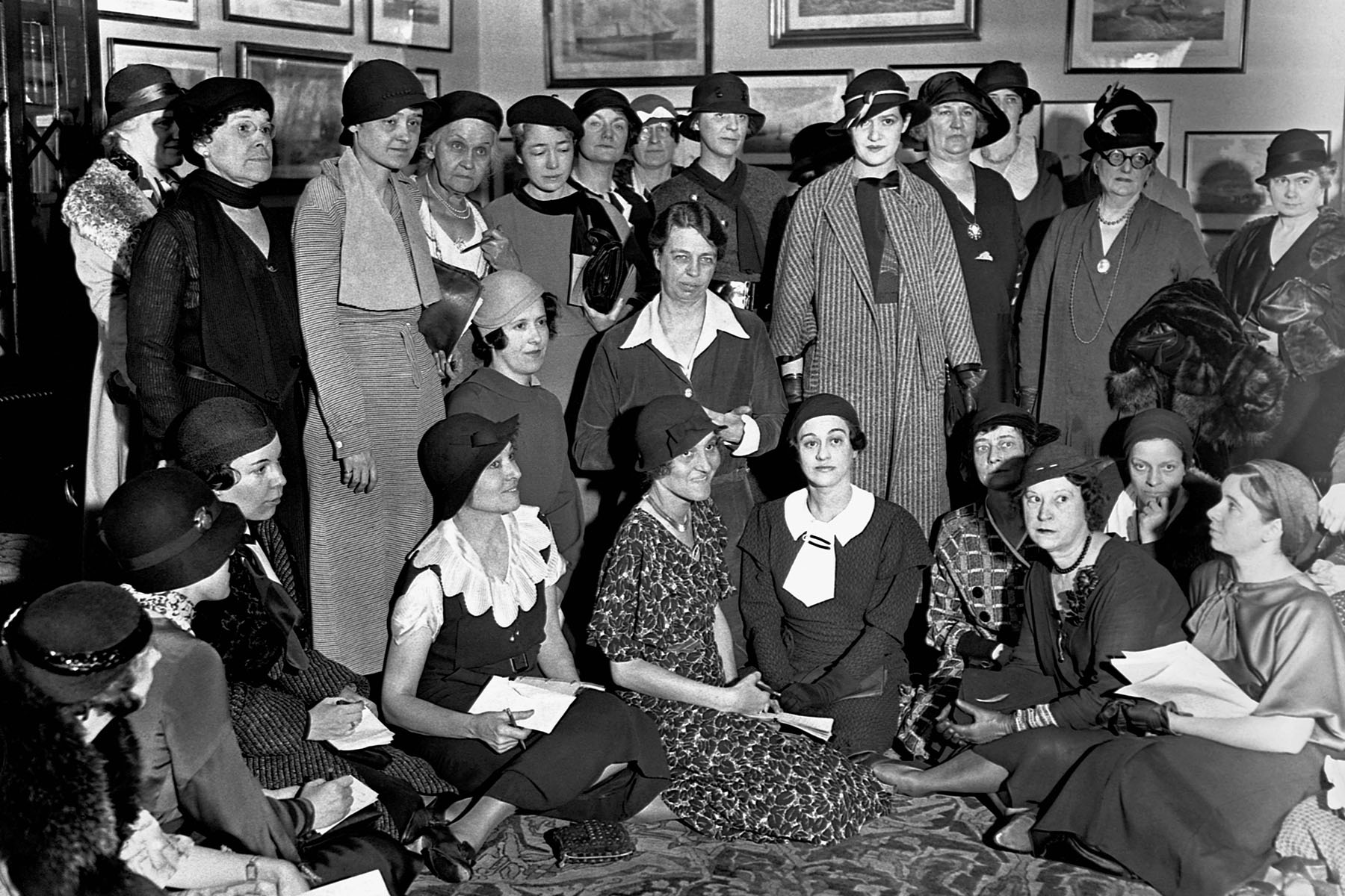 Eleanor Roosevelt is pictured with female journalists in the Treaty Room of the White House.
