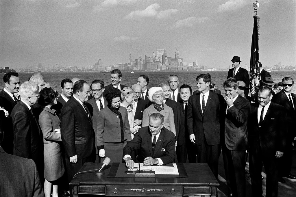 President Lyndon B. Johnson signing the Immigration and Nationality Act of 1965 on Liberty Island in New York City.