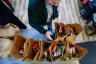 Volunteers at the Lutheran Settlement House pack bags of groceries to distribute to the local community for their daily food pantry in Philadelphia.