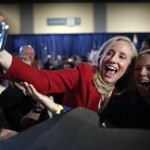 Spanberger takes a selfie with a supporter during election night celebrations.