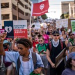 Protesters march in the street during an abortion-rights rally in Austin, Texas