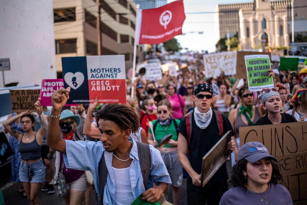 Protesters march in the street during an abortion-rights rally in Austin, Texas