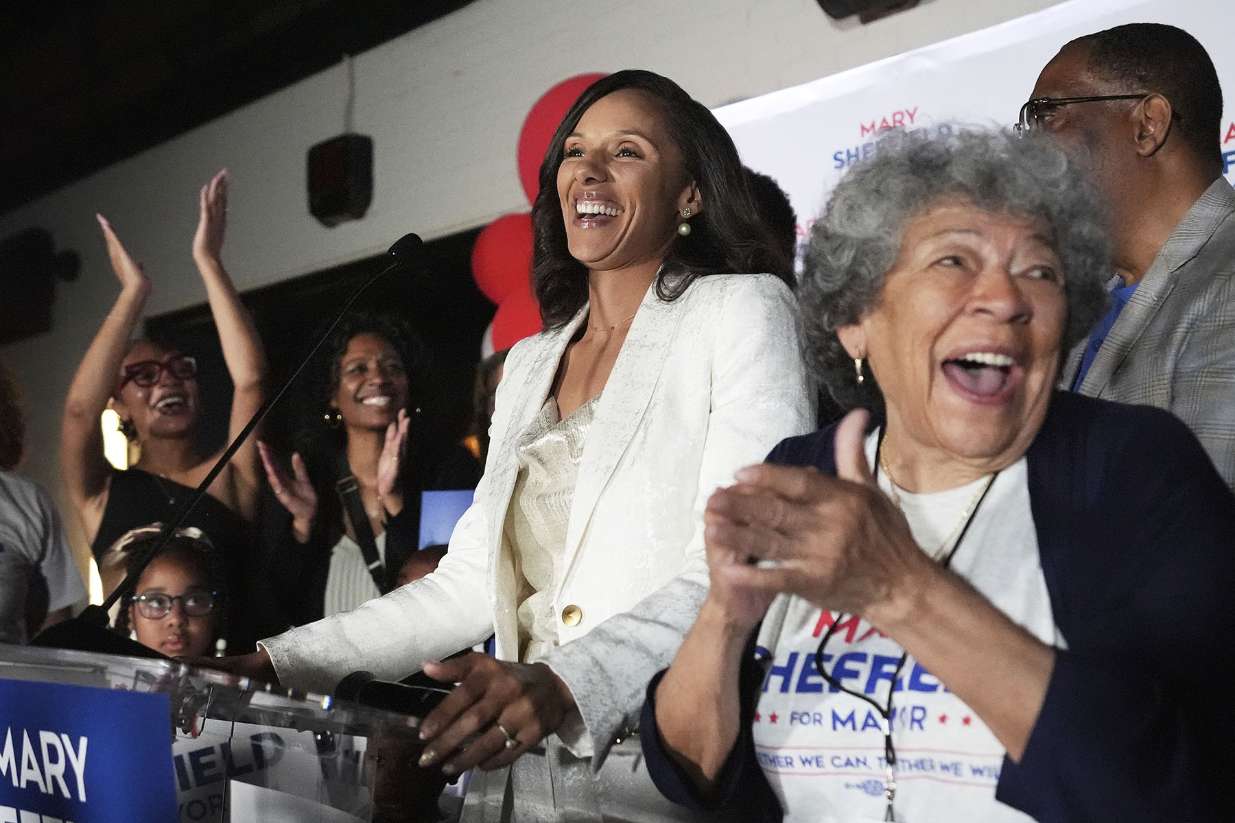 Detroit mayoral candidate Mary Sheffield speaks at a campaign watch party as supporters cheer.