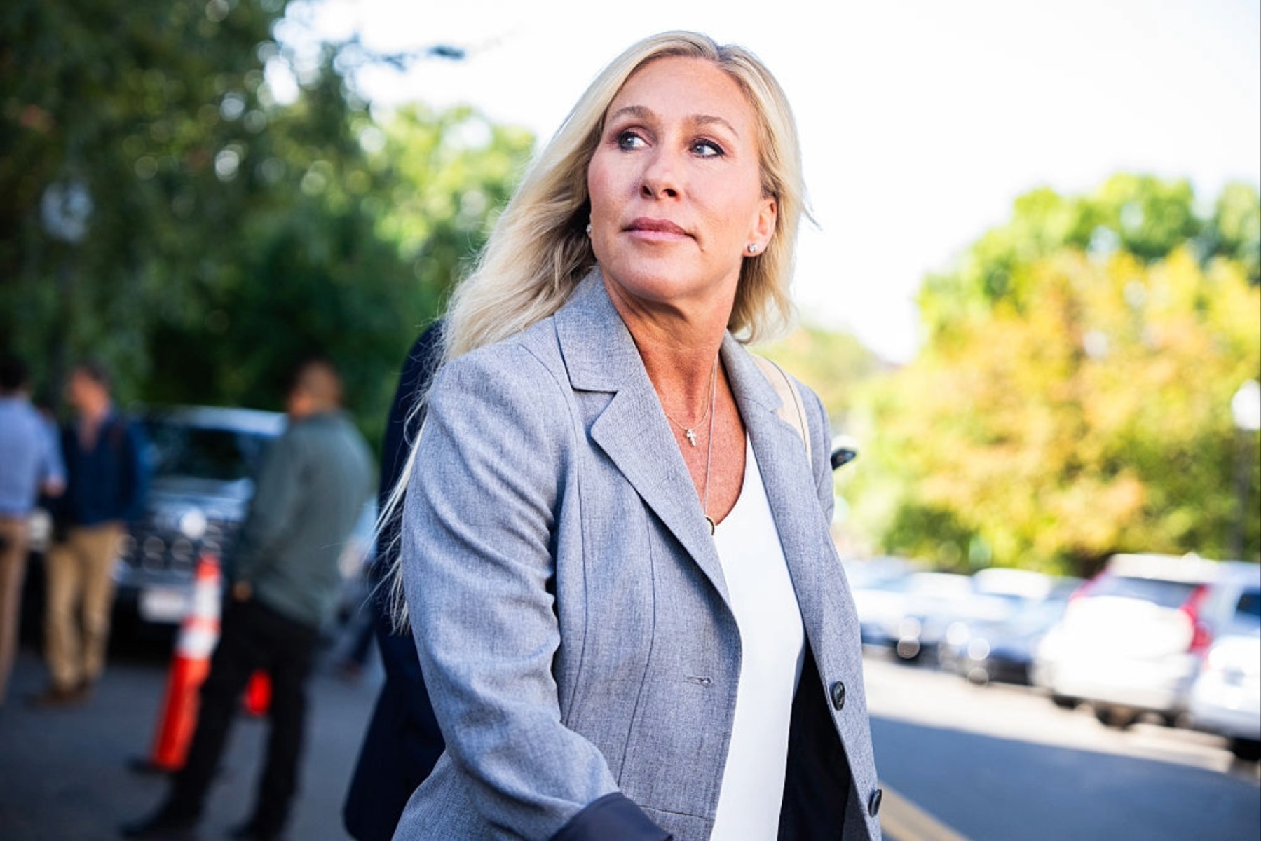 Rep. Marjorie Taylor Greene, R-Ga., talks with reporters after a meeting.
