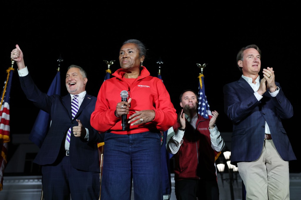 Virginia Republican gubernatorial candidate Winsome Earle-Sears stands onstage at the end of a campaign rally.