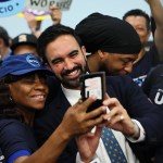 New York mayoral candidate Zohran Mamdani takes photos with supporters during a press conference.