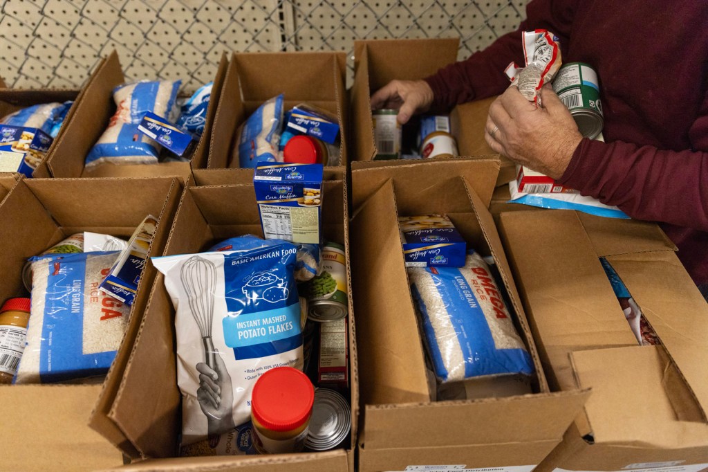 Boxes of food are packed on a table.