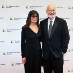 The Reiners stand together on a red carpet in front of a wall that says the Kennedy Center Honors.