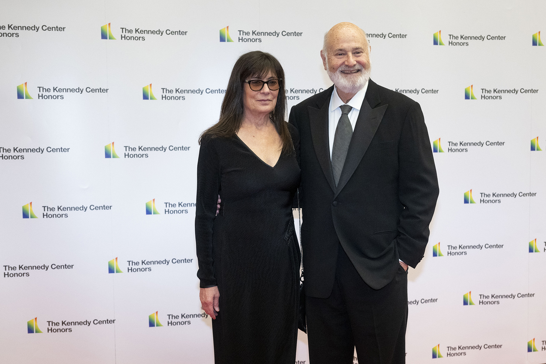 The Reiners stand together on a red carpet in front of a wall that says the Kennedy Center Honors.