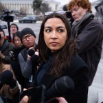 Rep. Alexandria Ocasio-Cortez is interviewed by reporters outside the Capitol.
