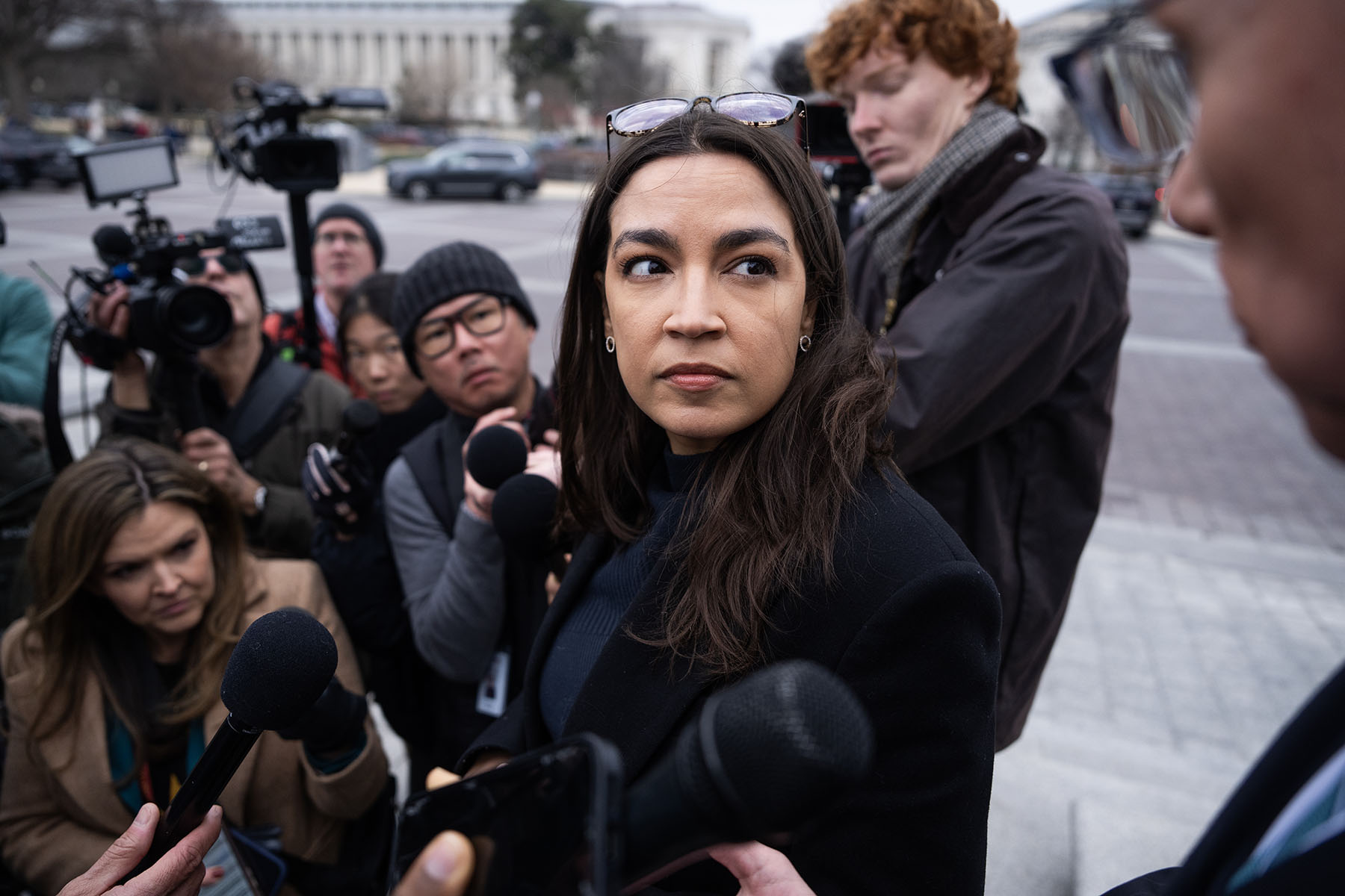 Rep. Alexandria Ocasio-Cortez is interviewed by reporters outside the Capitol.