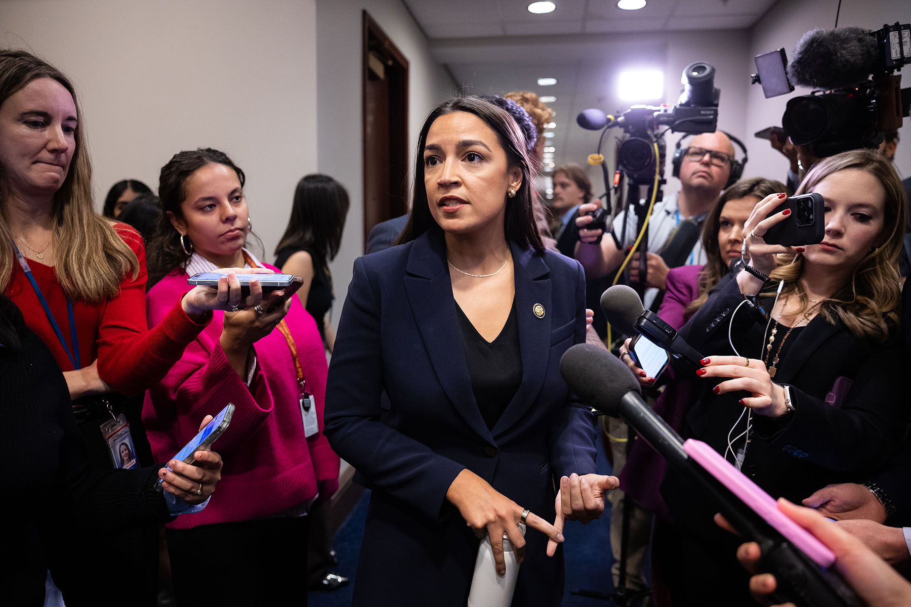 Rep. Alexandria Ocasio-Cortez speaks with reporters on Capitol Hill.