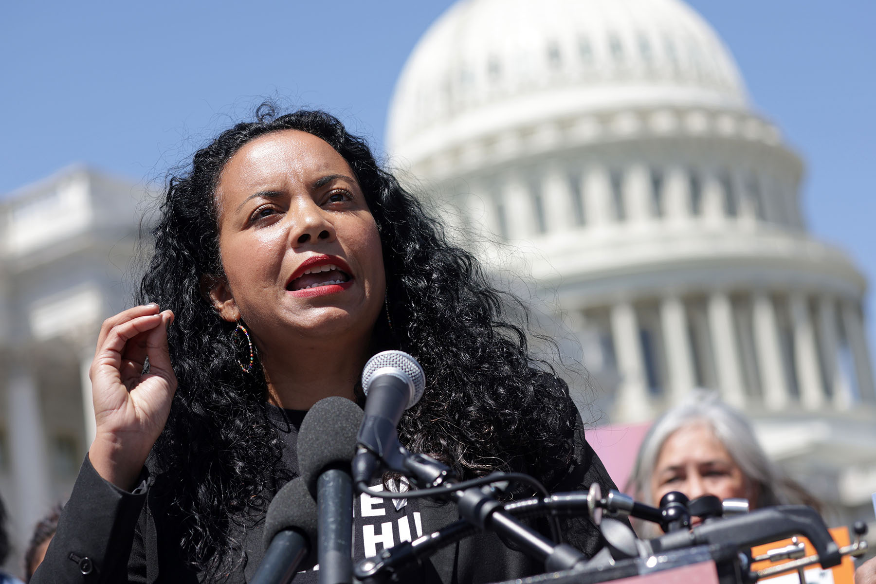 Analilia Mejia speaks during a news conference outside the Capitol.
