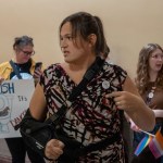 Jaelynn Abegg, a trans rights activist from Wichita, leads a group of around 50 people who used bathrooms throughout the Statehouse.