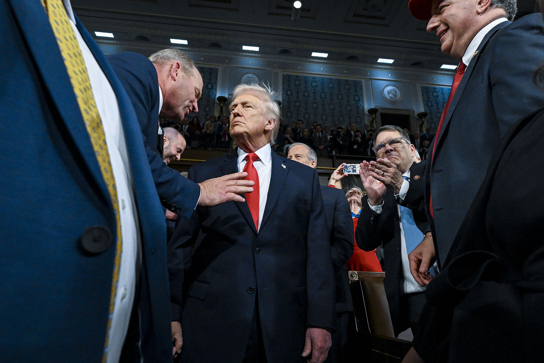 President Donald Trump enters the House Chamber to deliver the State of the Union address at the Capitol.