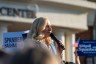 Spanberger speaks into a microphone in front of a crowd.