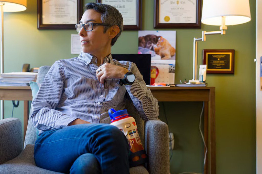 Collin Kuhn sits in an office looking to the right of the camera.