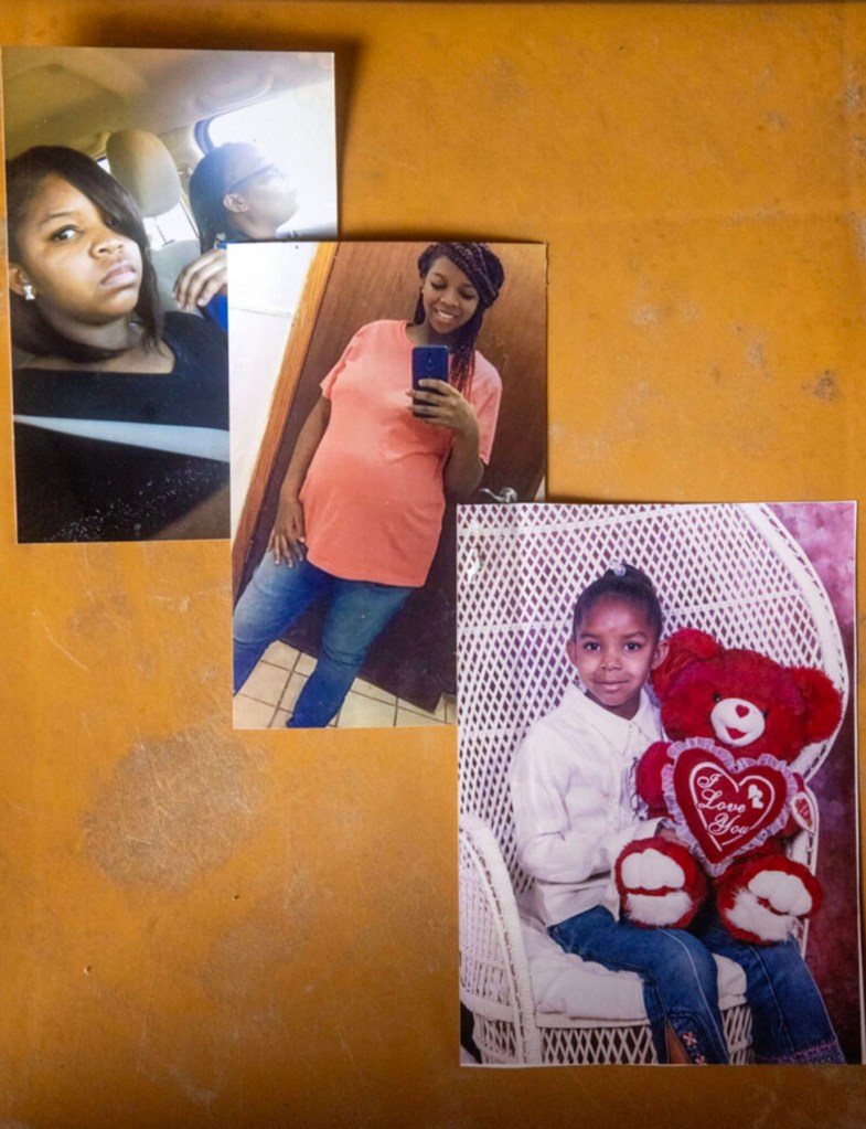Three printed photographs are arranged on a surface, showing a young woman taking a mirror selfie while pregnant, sitting in a car, and a child holding a large red teddy bear.