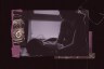 Collage of a silhouetted person sitting by a window holding a baby in their arms, while an Immigration and Customs Enforcement (ICE) badge appears alongside the scene.