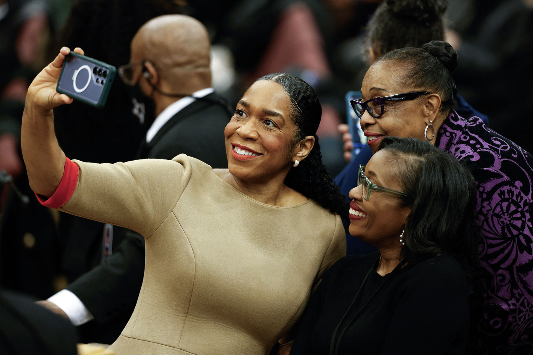 Lt. Gov. Juliana Stratton takes a selfie as she attends a public memorial service to celebrate the life of civil rights activist Reverend Jesse Jackson.
