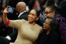 Lt. Gov. Juliana Stratton takes a selfie as she attends a public memorial service to celebrate the life of civil rights activist Reverend Jesse Jackson.