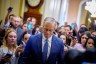 Senate Majority Leader John Thune walks toward the Senate floor at the Capitol Building.