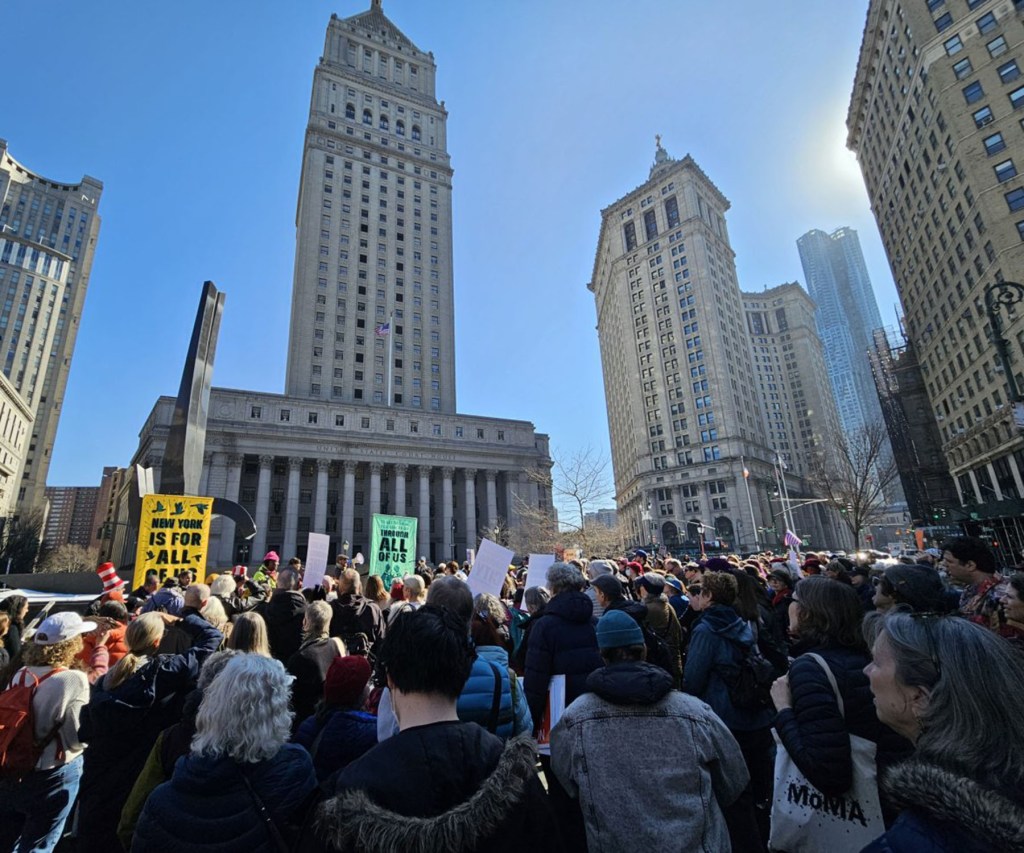 Hundreds gathered to sing together in protest of U.S. Immigration and Customs Enforcement violence in New York City.