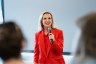 Emily Ramshaw speaking to a crowd during an event hosted by The 19th for International Women's Day.