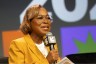 Errin Haines speaking at SXSW during an International Women's Day panel.