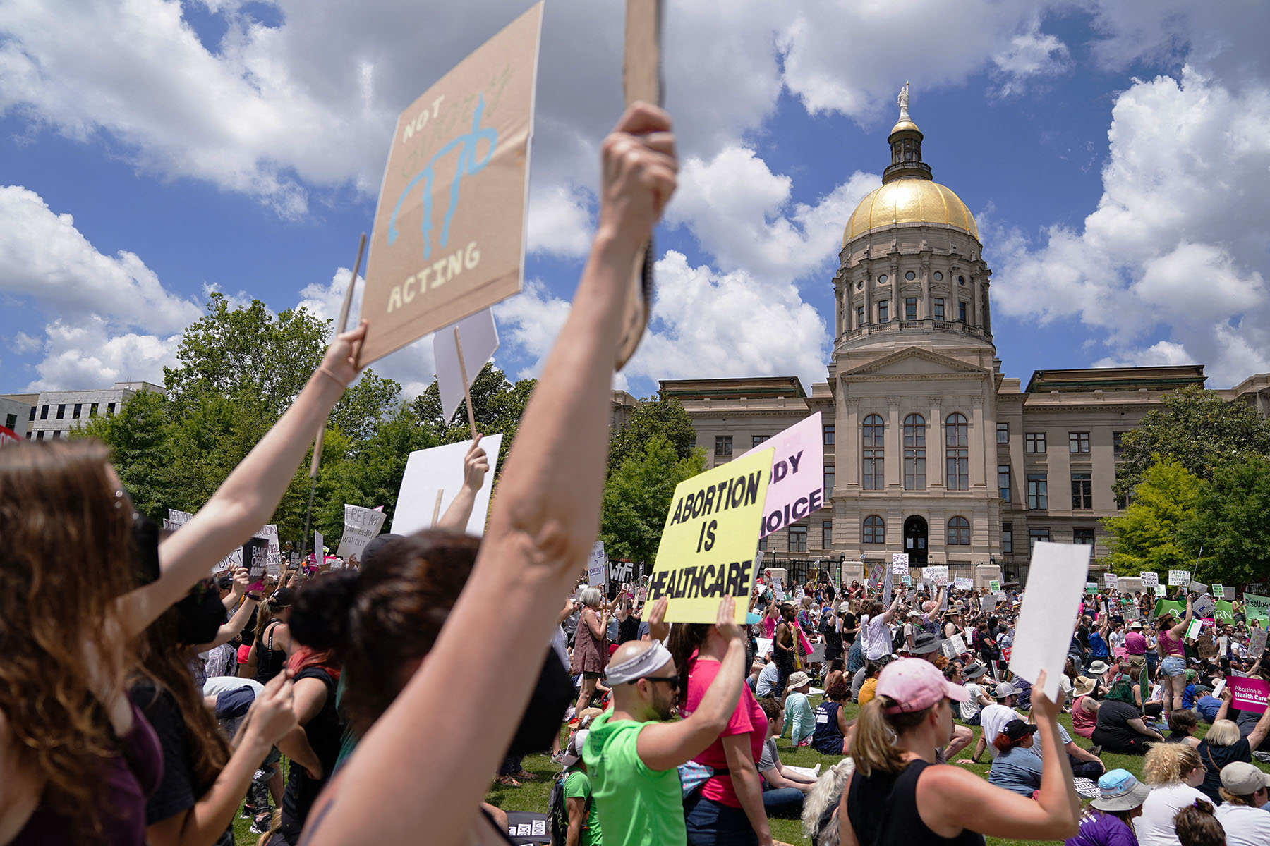Activists rally outside the State Capitol in support of abortion rights.
