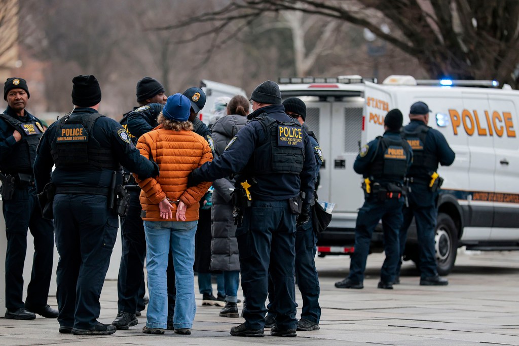 Protesters are arrested during a demonstration with Gender Liberation Movement and ACT UP blocking the entrance to the Department of Health and Human Services.