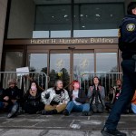 Protesters with Gender Liberation Movement and ACT UP block the entrance to the Department of Health and Human Services while protesting the Trump administration’s plan to cut federal funding to clinics providing care for transgender youth.
