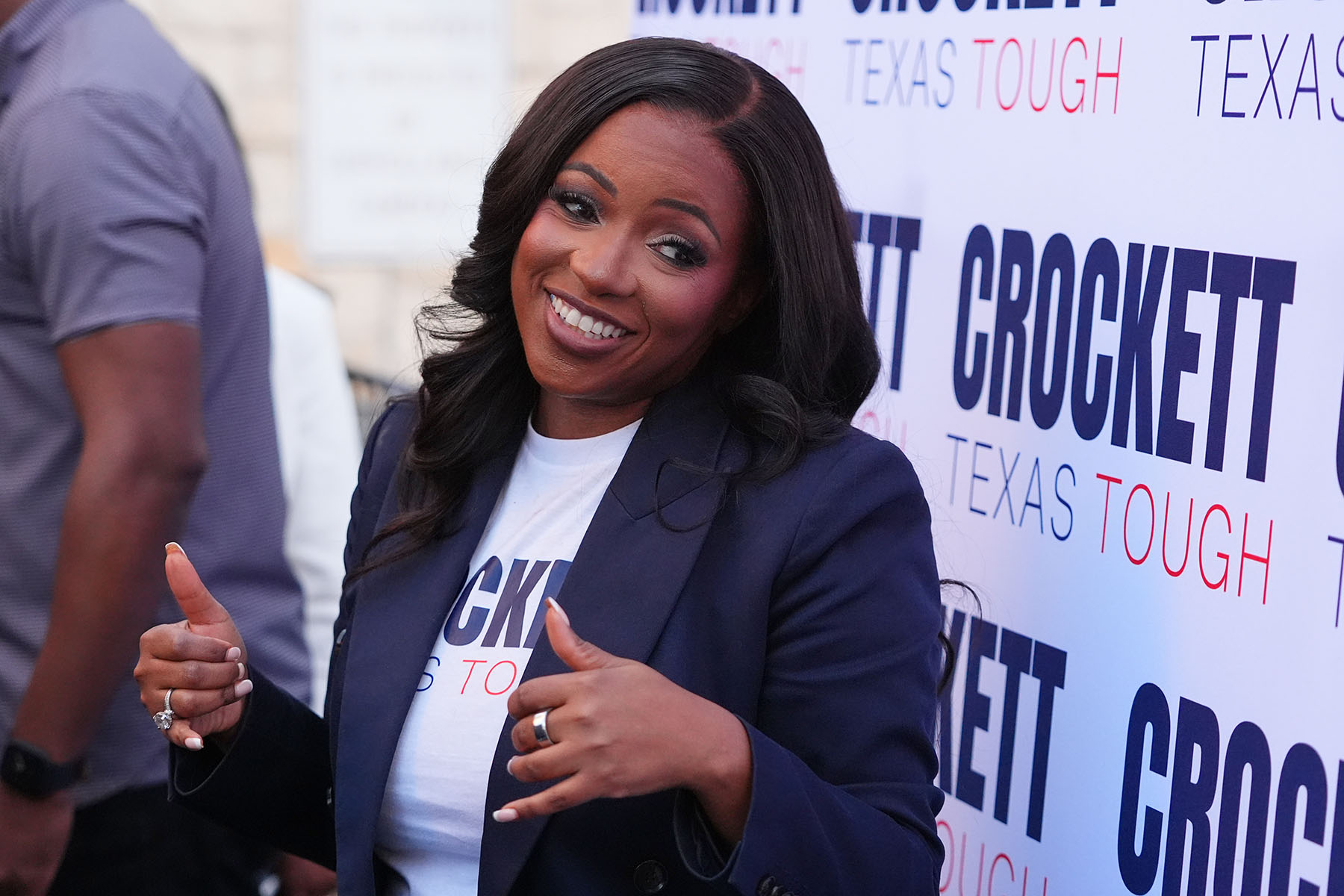 Rep. Jasmine Crockett smiles at supporters during a campaign event in Richardson, Texas.