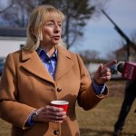 Gov. Janet Mills speaks to the press while attending an event at the Blaine House.