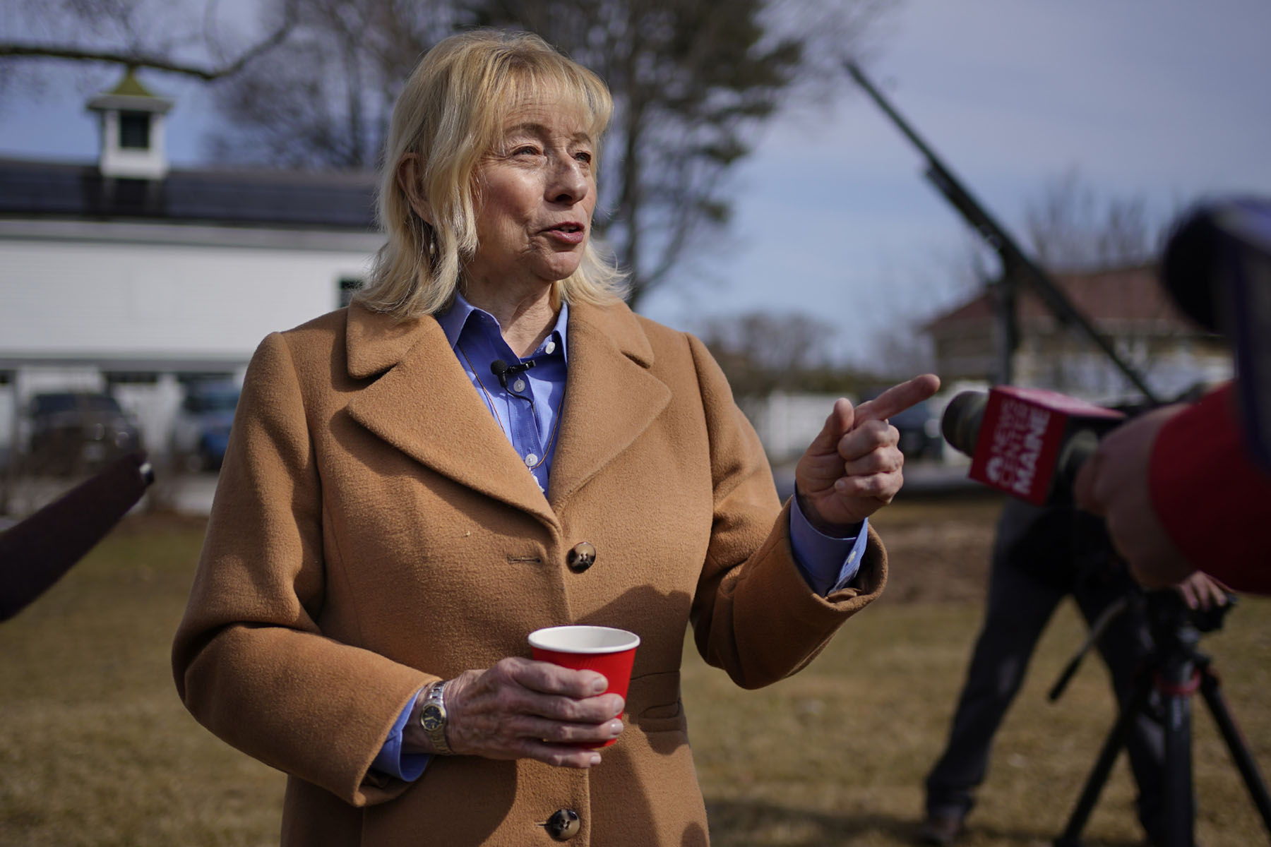 Gov. Janet Mills speaks to the press while attending an event at the Blaine House.