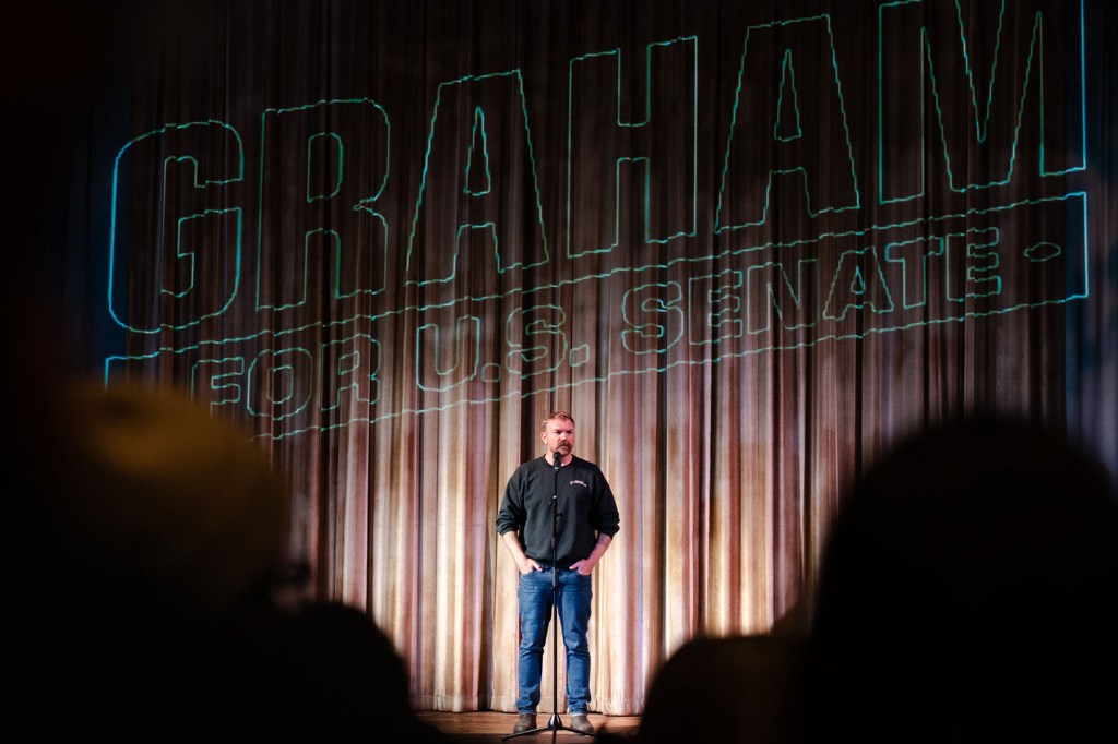 Senatorial candidate Graham Platner speaks at a town hall at the Leavitt Theater.