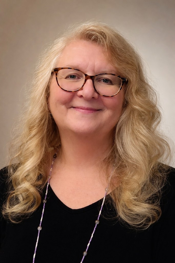 Blonde woman smiling at camera