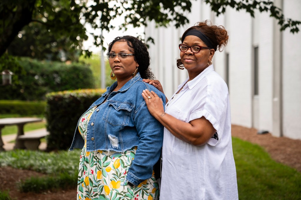 Alicia Cleveland and Vernell Truitt stand together outside the National Domestic Workers Alliance office in Hapeville, Georgia.