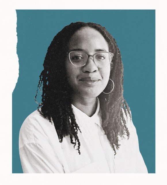 portrait of a woman with glasses, hoop earrings and long locs against a teal background.