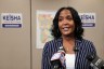 Gubernatorial candidate and former mayor of Atlanta, Keisha Lance Bottoms, speaks to supporters and members of the media. Behind her, a map of Georgia and campaign posters are seen in the background.