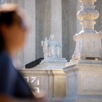 The marble statue Contemplation of Justice is seen outside the Supreme Court building.