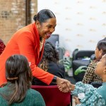 Lt. Gov. Juliana Stratton smiles while shaking hands with an attendee at a WeChat event in Chicago.